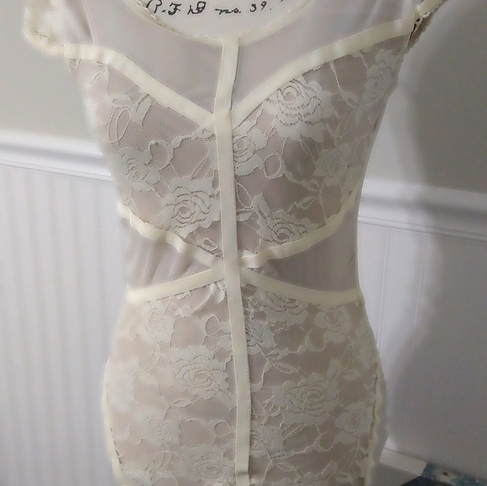 Nude mini dress with bondage cross patterns